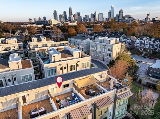 birds eye view of property with a view of city