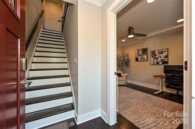 staircase with crown molding, recessed lighting, ceiling fan, wood finished floors, and baseboards