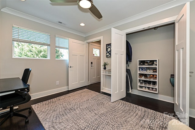 office space with ornamental molding, dark wood-style flooring, visible vents, and baseboards