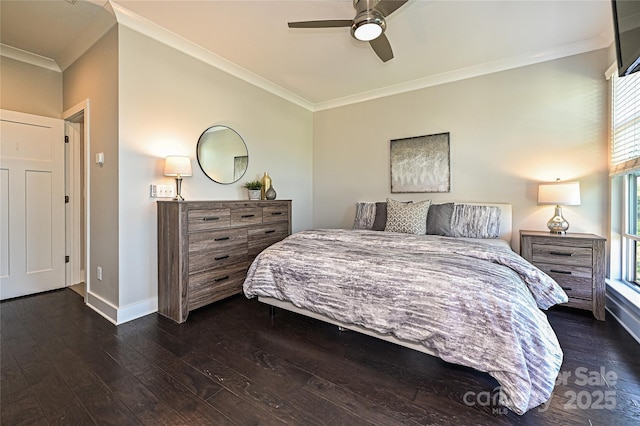 bedroom with baseboards, dark wood-style flooring, a ceiling fan, and crown molding