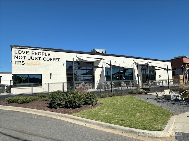 view of building exterior featuring fence