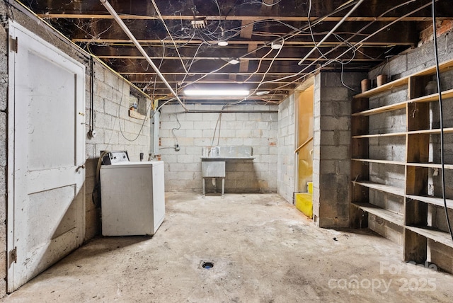 unfinished basement with washing machine and clothes dryer