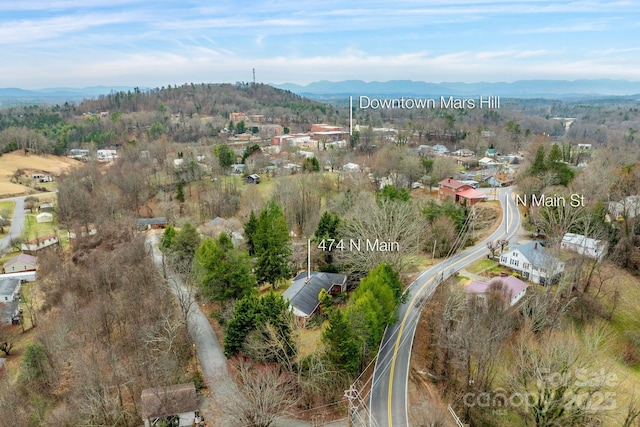 drone / aerial view featuring a mountain view