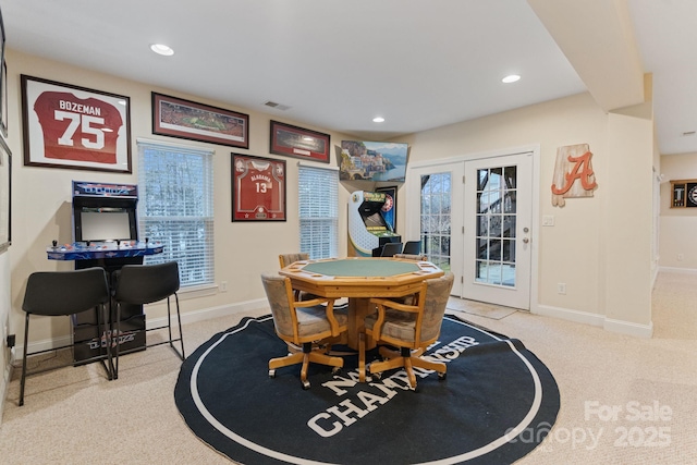 carpeted dining area with baseboards, french doors, visible vents, and recessed lighting