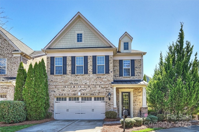 craftsman-style house featuring concrete driveway, an attached garage, and brick siding