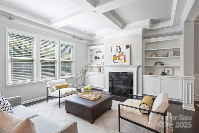 living area featuring coffered ceiling, a premium fireplace, beam ceiling, dark wood-type flooring, and crown molding