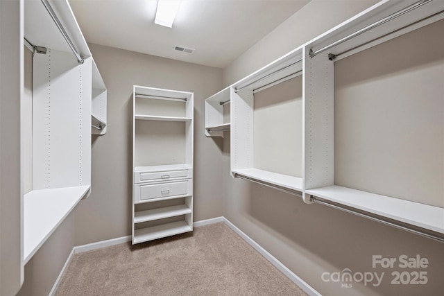 walk in closet with carpet flooring and visible vents