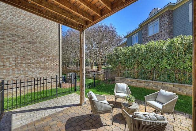 view of patio featuring an outdoor living space and a fenced backyard