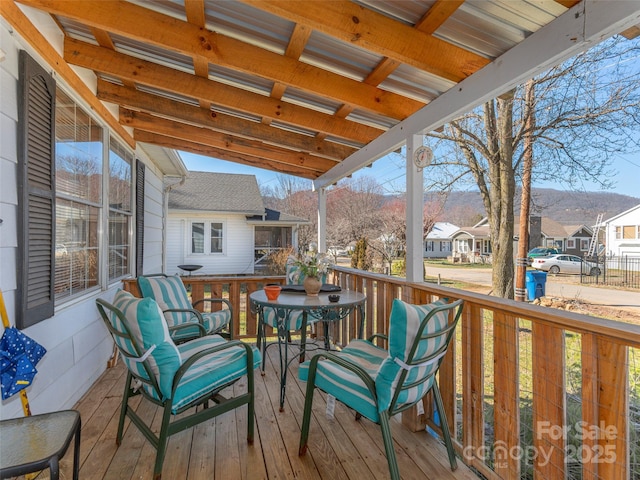 wooden deck with a residential view