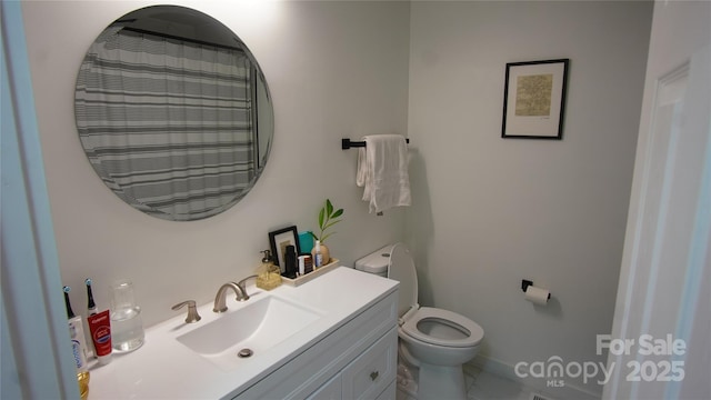 full bathroom featuring vanity and toilet