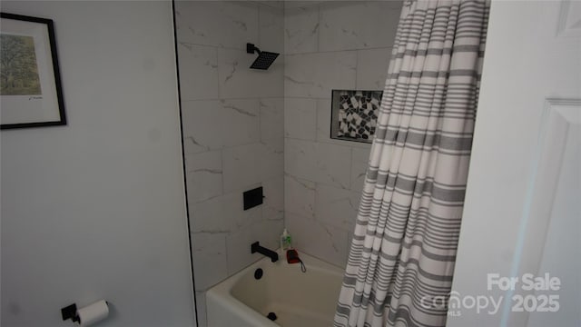 bathroom with shower / bath combo with shower curtain