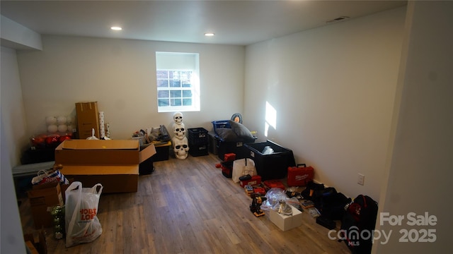 interior space featuring visible vents, wood finished floors, and recessed lighting