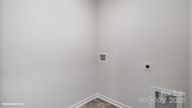 clothes washing area featuring laundry area, hookup for a washing machine, electric dryer hookup, and baseboards