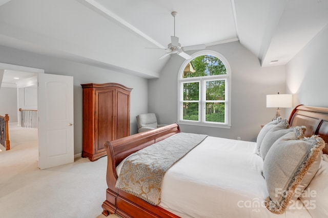 bedroom with a ceiling fan, light carpet, and vaulted ceiling