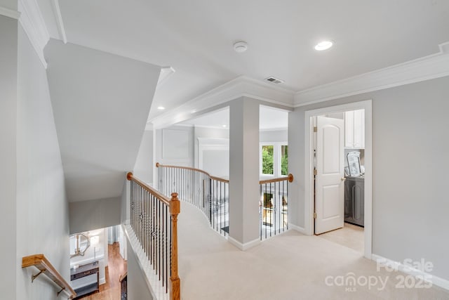 corridor with baseboards, visible vents, crown molding, an upstairs landing, and recessed lighting