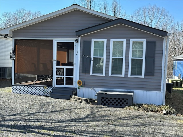 manufactured / mobile home featuring a sunroom and central air condition unit