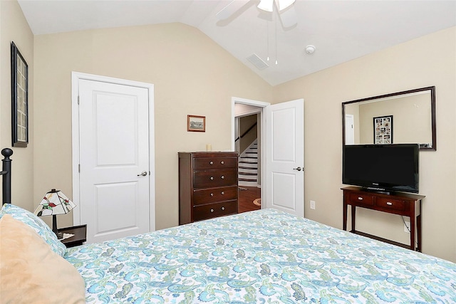 bedroom featuring vaulted ceiling, ceiling fan, and visible vents