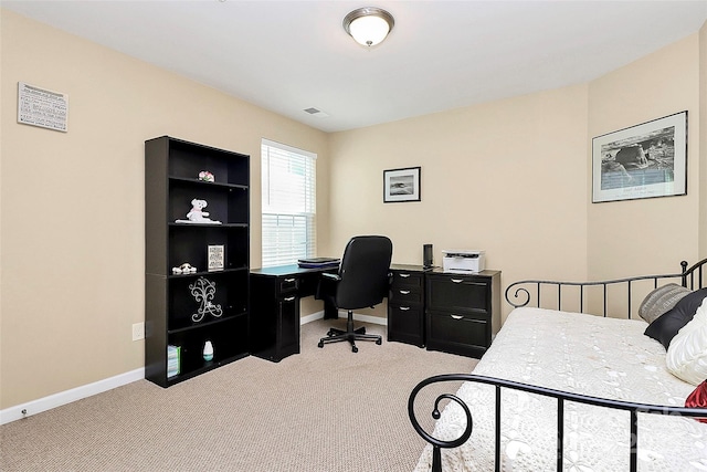 carpeted bedroom featuring baseboards