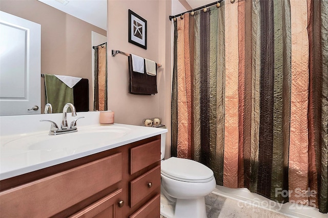 full bathroom with visible vents, vanity, and toilet