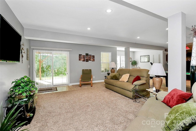 living area featuring recessed lighting, carpet, a healthy amount of sunlight, and baseboards