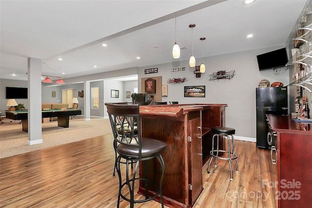 bar featuring billiards, bar, freestanding refrigerator, light wood-style floors, and recessed lighting