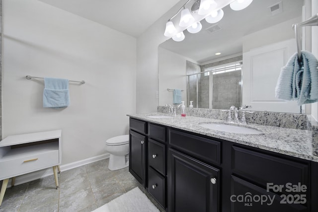 full bathroom with visible vents, a sink, a shower stall, and double vanity