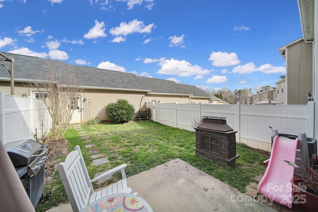 view of yard with a fenced backyard and a patio