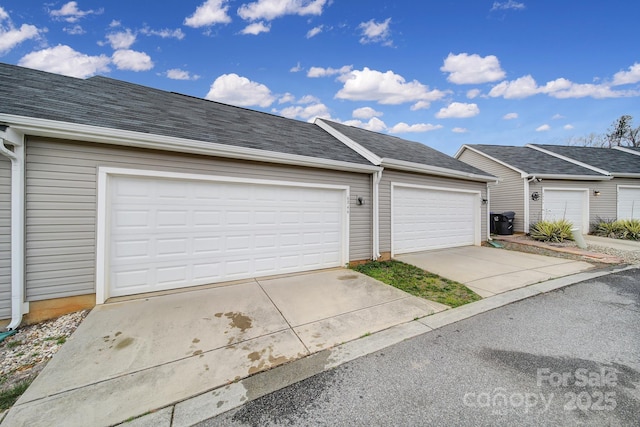 garage featuring driveway