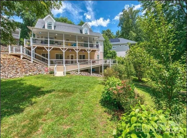 back of house featuring a yard