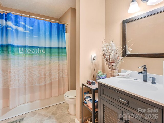 bathroom with shower / tub combo, vanity, and toilet