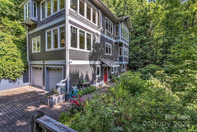 322 Crestview Dr, Black Mountain, NC 28711 - view of home's exterior with decorative driveway and a garage