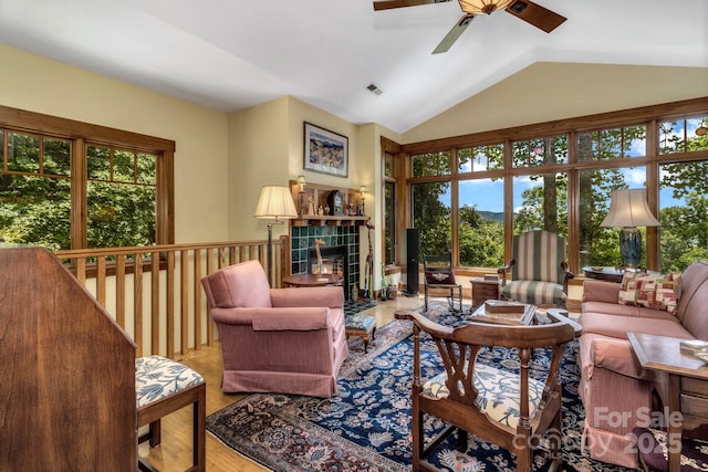 322 Crestview Dr, Black Mountain, NC 28711 - living room with a wealth of natural light, visible vents, a tiled fireplace, and vaulted ceiling