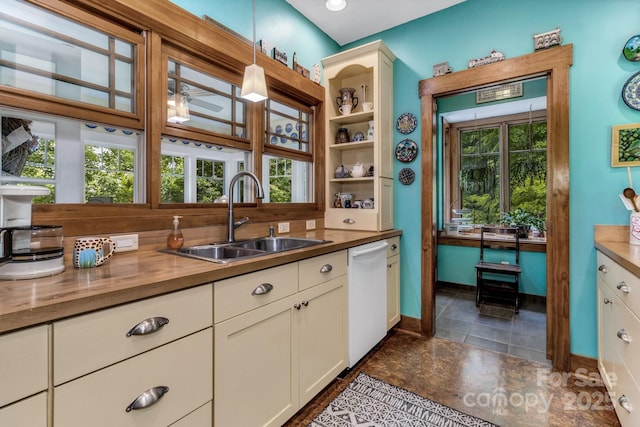322 Crestview Dr, Black Mountain, NC 28711 - kitchen featuring butcher block countertops, white dishwasher, hanging light fixtures, white cabinetry, and a sink