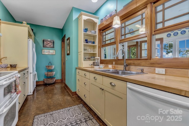 322 Crestview Dr, Black Mountain, NC 28711 - kitchen featuring white appliances, baseboards, a sink, hanging light fixtures, and butcher block counters
