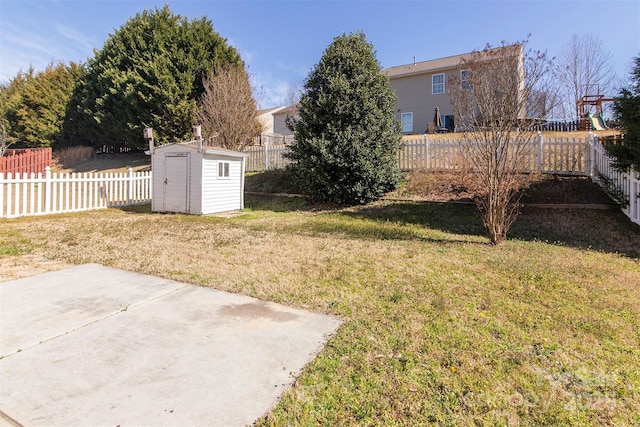 view of yard featuring an outbuilding, a fenced backyard, a patio, and a storage shed