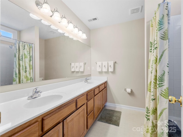 full bathroom featuring a shower with curtain, visible vents, and a sink