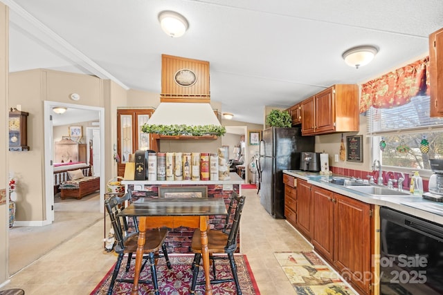 kitchen with brown cabinets, light countertops, a sink, and black appliances