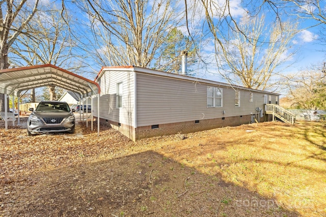 view of side of property featuring a carport and crawl space