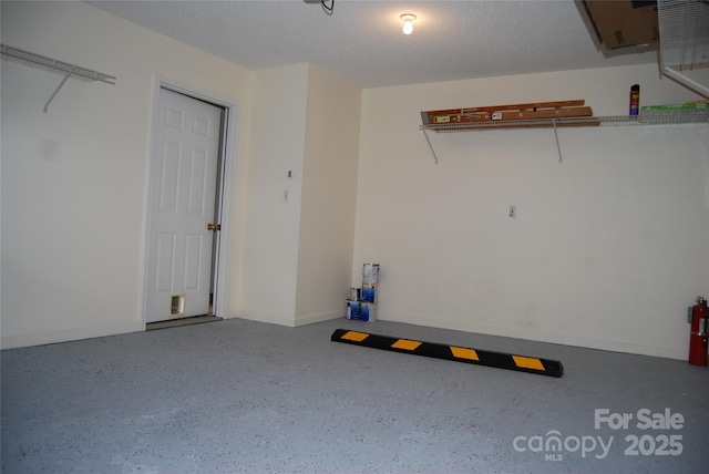 garage featuring baseboards