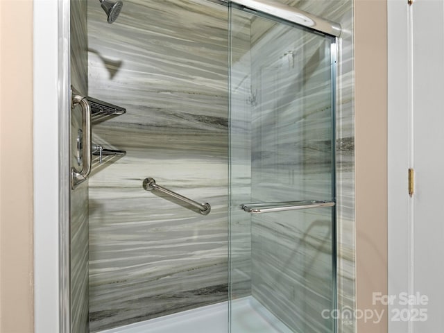 full bathroom with a marble finish shower