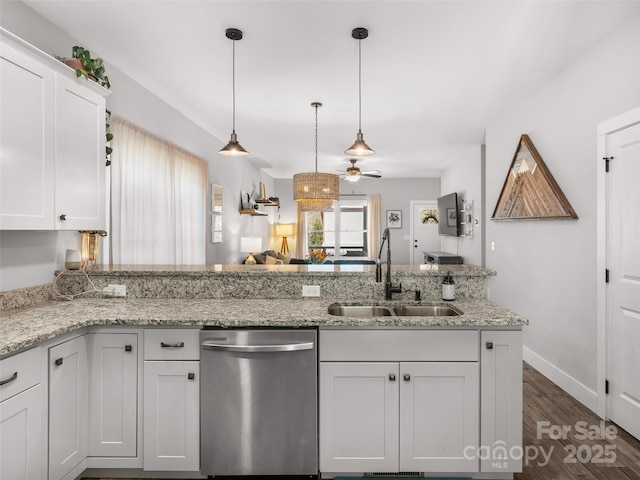 kitchen featuring dishwasher, dark wood-type flooring, a sink, and white cabinetry