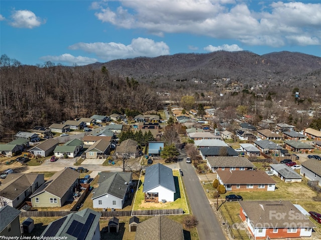 birds eye view of property with a residential view and a mountain view