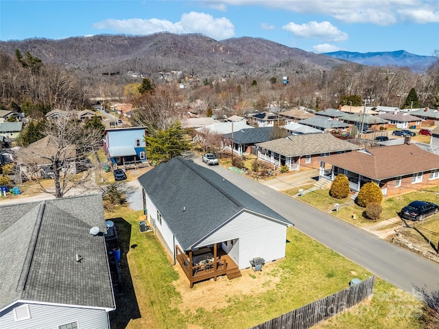 drone / aerial view featuring a residential view and a mountain view