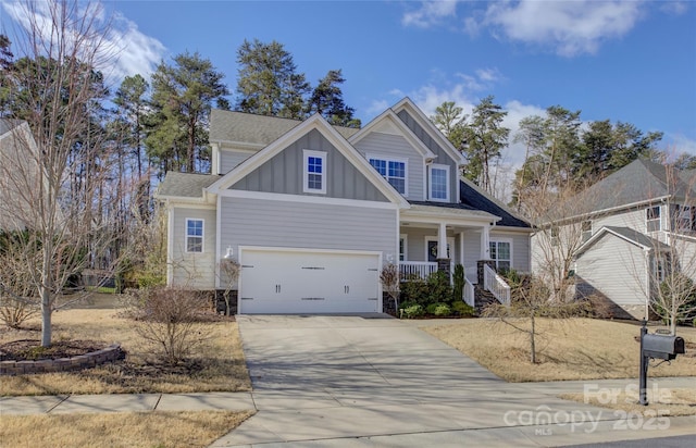 craftsman-style home featuring a porch, a garage, a shingled roof, concrete driveway, and board and batten siding