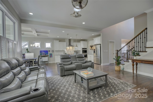 living area with baseboards, stairway, dark wood-type flooring, and recessed lighting