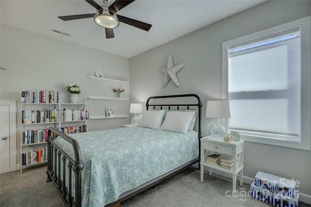 bedroom with carpet flooring, visible vents, and a ceiling fan