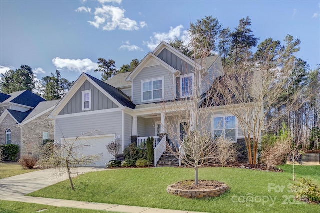 view of front of property with a front lawn, a porch, board and batten siding, concrete driveway, and an attached garage