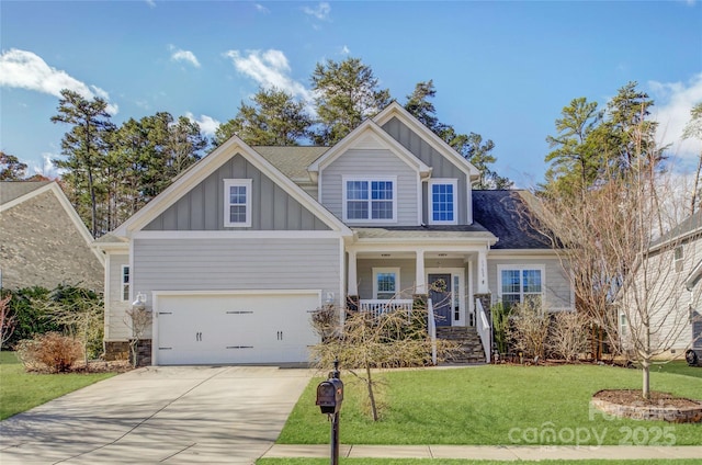 craftsman inspired home with driveway, covered porch, board and batten siding, a front yard, and a garage