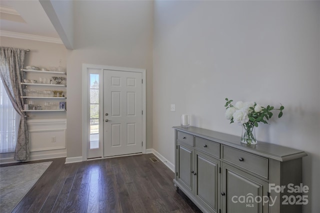 17609 Caddy Ct, Charlotte, NC 28278 - entrance foyer with baseboards, dark wood-type flooring, and ornamental molding