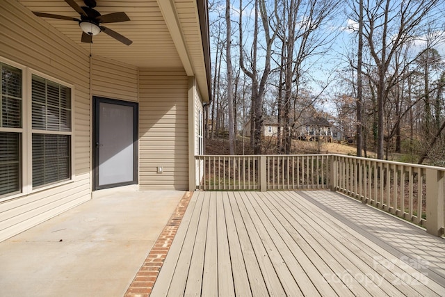 wooden deck featuring a ceiling fan